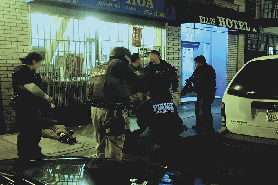 police officer arresting a suspect labelled diagram